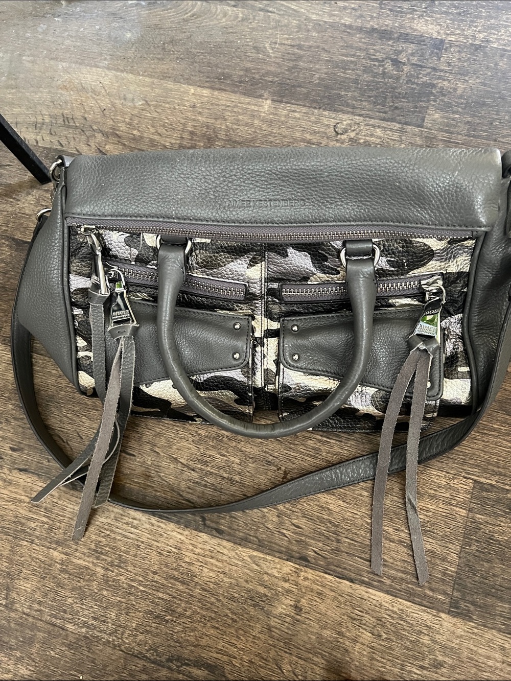 Fossil Gray Camo-Print Leather Satchel with Tassel Accents
Aimee Kestenberg
